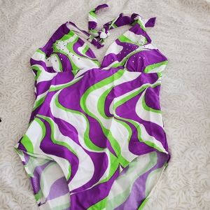 BATHING SUIT, TO BE WORN WITH AN OPEN SKIRT TO THE SIDE.